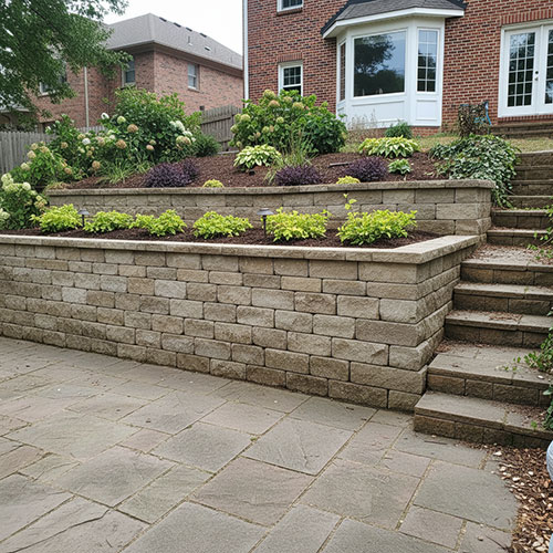 tiered stone retaining walls and low-maintenance plantings.